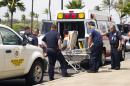 A 16-year-old boy, seen sitting on a stretcher center, who stowed away in the wheel well of a flight from San Jose, Calif., to Maui is loaded into an ambulance at Kahului Airport in Kahului, Maui, Hawaii Sunday afternoon, April 20, 2014. The boy survived the trip halfway across the Pacific Ocean unharmed despite frigid temperatures at 38,000 feet and a lack of oxygen, FBI and airline officials said. FBI spokesman Tom Simon in Honolulu told The Associated Press on Sunday night that the boy was questioned by the FBI after being discovered on the tarmac at the Maui airport with no identification. "Kid's lucky to be alive," Simon said. (AP Photo/The Maui News, Chris Sugidono)