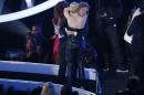 Miley Cyrus hugs her spokesperson Jesse after he   accepted the award for video of the year for "Wrecking Ball" on stage   during the 2014 MTV Video Music Awards in Inglewood