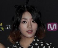 This July 24, 2014 photo, shows Go Eun-bi, a member of South Korean group Ladies’ Code, during a photo call to celebrate the 10th anniversary of Mnet M Countdown in Goyang, South Korea. Go Eun-bi, better known as EunB, died after a van carrying the pop group crashed into a guard rail on a rain-drenched highway near Seoul, police said Thursday, Sept. 4, 2014. (AP Photo/Ahn Young-joon)