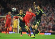 Liverpool's Adam Lallana, centre, and Middlesbrough's Lee Tomlin, right, vie for the ball during the English League Cup Third Round match Liverpool against Middlesbrough at Anfield, Liverpool, England, Tuesday Sept. 23, 2014. (AP Photo/PA, Peter Byrne) UNITED KINGDOM OUT NO SALES NO ARCHIVE