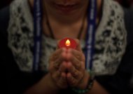 A Malaysian Buddhist offers prayers for passengers of missing Malaysia Airlines (MAS) flight MH370 at a Buddhist temple in Kuala Lumpur on March 31, 2014