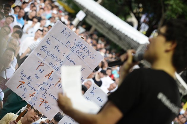 SINGAPORE - JUNE 07: Roy Ngerng speaks during the 'Return Our CPF' protest at the Speakers' Corner at Hong Lim Park on June 7, 2014 in Singapore. Roy Ngerng is locked in a legal dispute with the Prime Minister of Singapore about an alleged defamatory article on the Singaporeans' CPF saving posted by Roy. Through crowd funding, Roy has managed to raise more than $90,000 for his legal defence fund within a week.The protest was staged to demand greater transparency and accountability from the government on how the CPF monies is being utilized. (Photo by Suhaimi Abdullah/Getty Images)