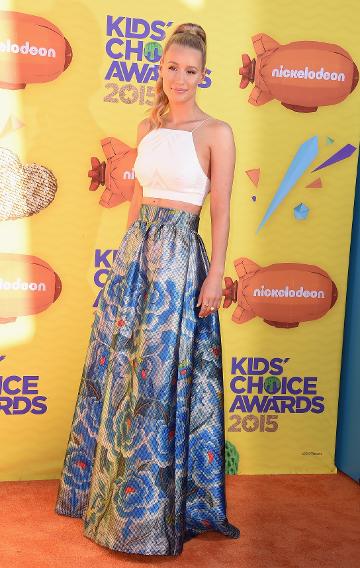 Iggy Azalea in a crop top and flared floral skirt