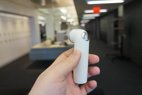 HTC Re mini-camera in a hand