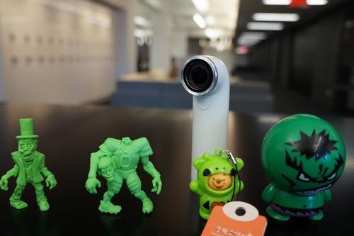 HTC Re mini-camera with plastic toys