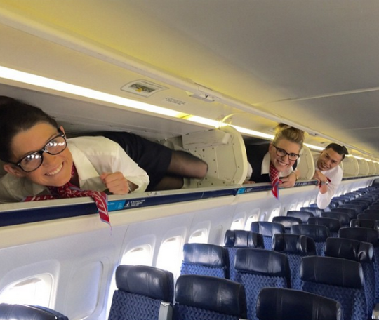 Say Squeeze Flight Attendants Pose In Overhead Bins On Instagram