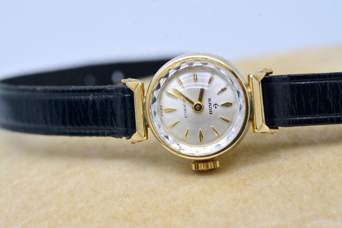 《寶萊精品》RADO 雷達表金白圓型手動女子錶