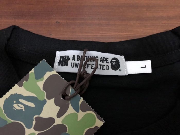 【熱賣精選】 正品日本bape x undefeated 新款19SS橘色宇宙猿人永不言敗迷彩黑色聯名款短袖T恤tee