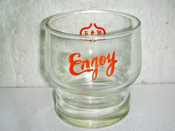 #T.(企業寶寶玩偶娃娃)已稍有年代早期保力達(Enjoy)玻璃杯1個!--具收藏價值!!/6房樂箱63/-P