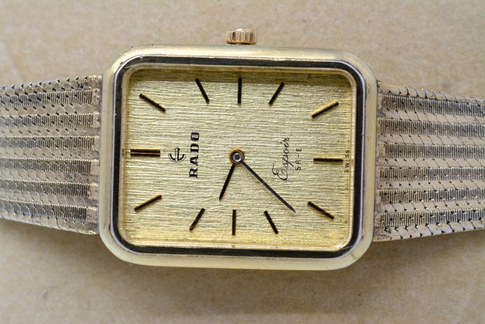 《寶萊精品》RADO 雷達表金黃方長型手動男士錶