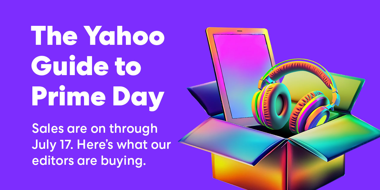 The words "The Yahoo Guide to Prime Day" in white, atop a purple background with a rainbow box with headphones and a tablet emerging from it. 