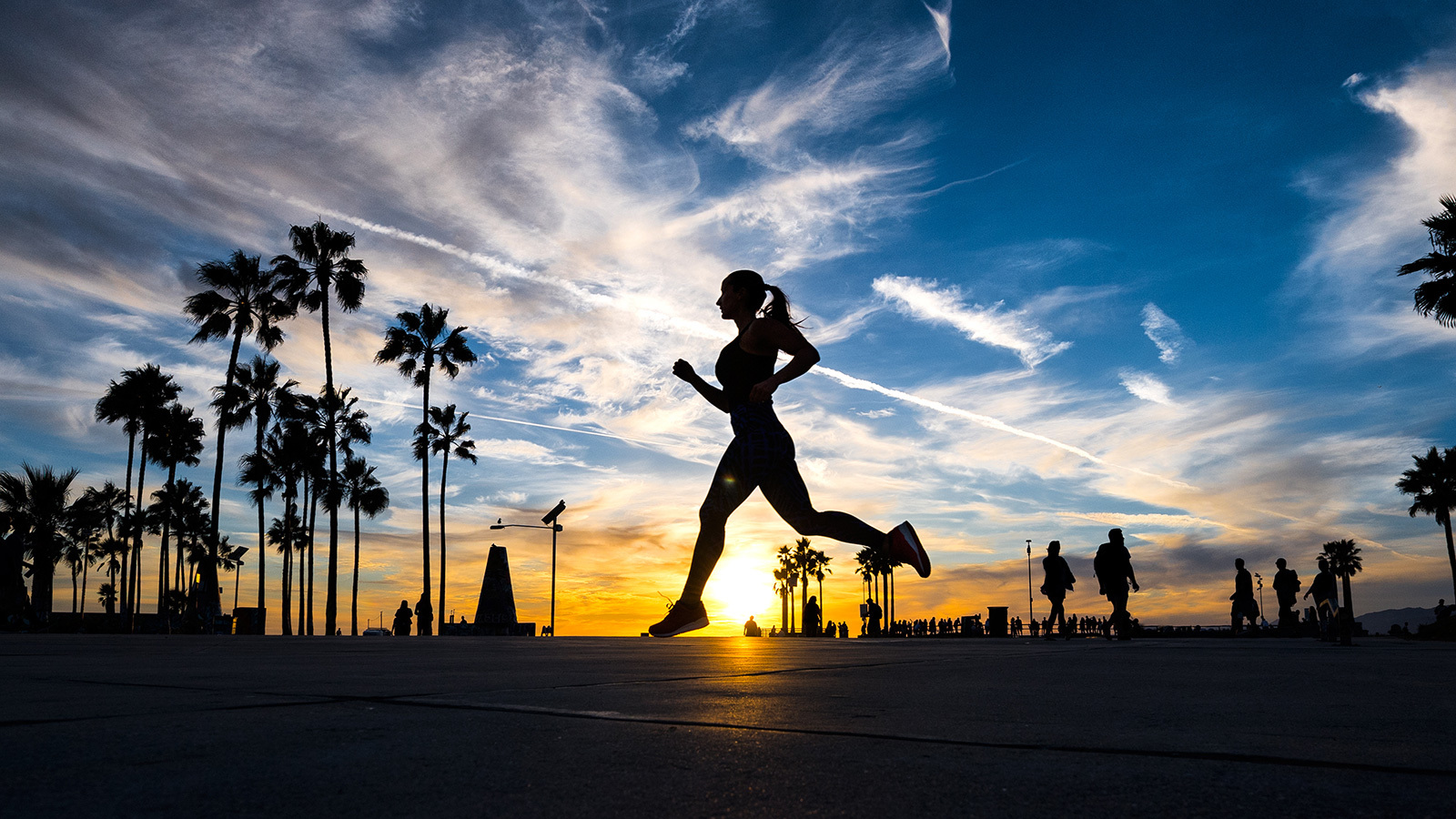Woman running during sunset