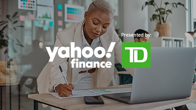 View of a woman working at a desk with Yahoo Finance and Presented By TD logos over top