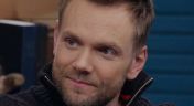 13. Joel McHale Wears a Navy Zip-up and High Tops