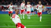 Leaders Leverkusen come from behind to claim late win at Leipzig