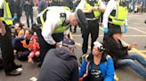 Just Stop Oil protesters clash with public after blocking road in London as 26 arrested