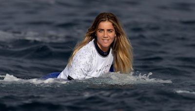 Olympic surfing resumes Thursday. Caroline Marks would pull double duty if she wins first heat