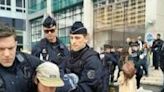 Police remove Extinction Rebellion activists outside Amundi HQ in Paris