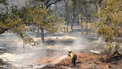 A ‘potentially historic’ heat wave intensifies along the West Coast, as dangerous wildfires spread