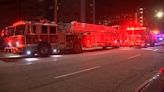 Firefighters notice downtown Atlanta high-rise on fire while driving by, officials say