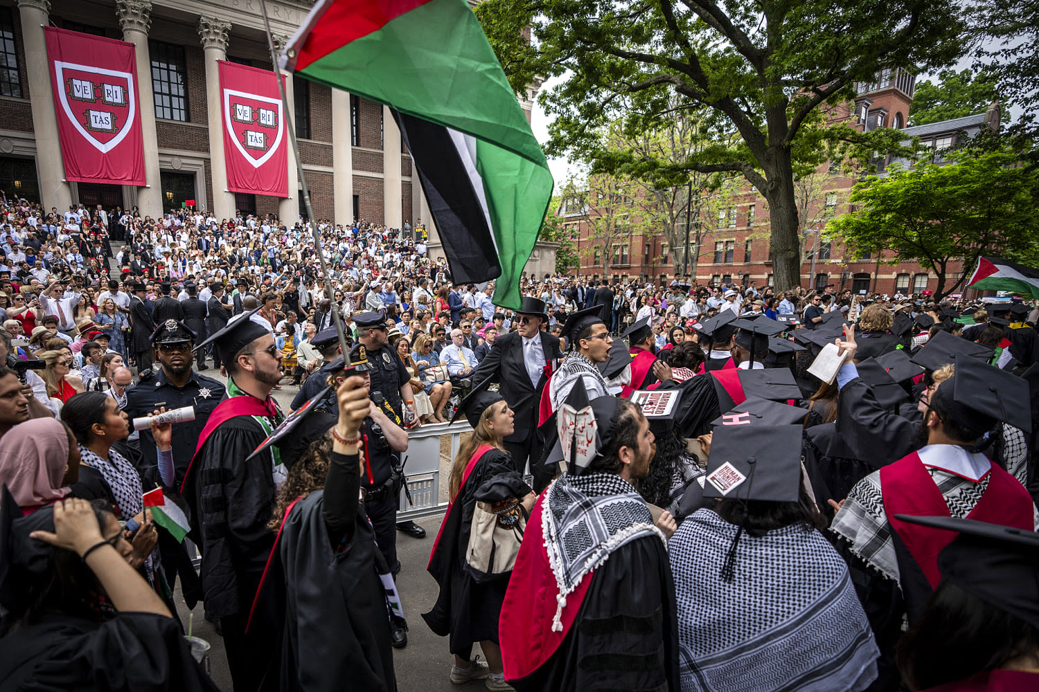 Hundreds walk out of Harvard College graduation; UCLA contends with new protest