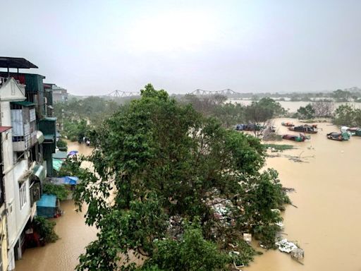 Hanoi flooded by swollen river as Typhoon Yagi leaves 179 dead