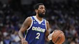 Kyrie Irving agrees to stay with Mavs, Doncic on a $126 million, 3-year deal, AP source says