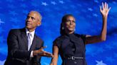 Barack and Michelle Obama electrify Democrats but warn of tight race