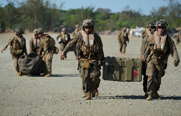 US, Australian and Philippine forces sink a ship during war drills in the disputed South China Sea