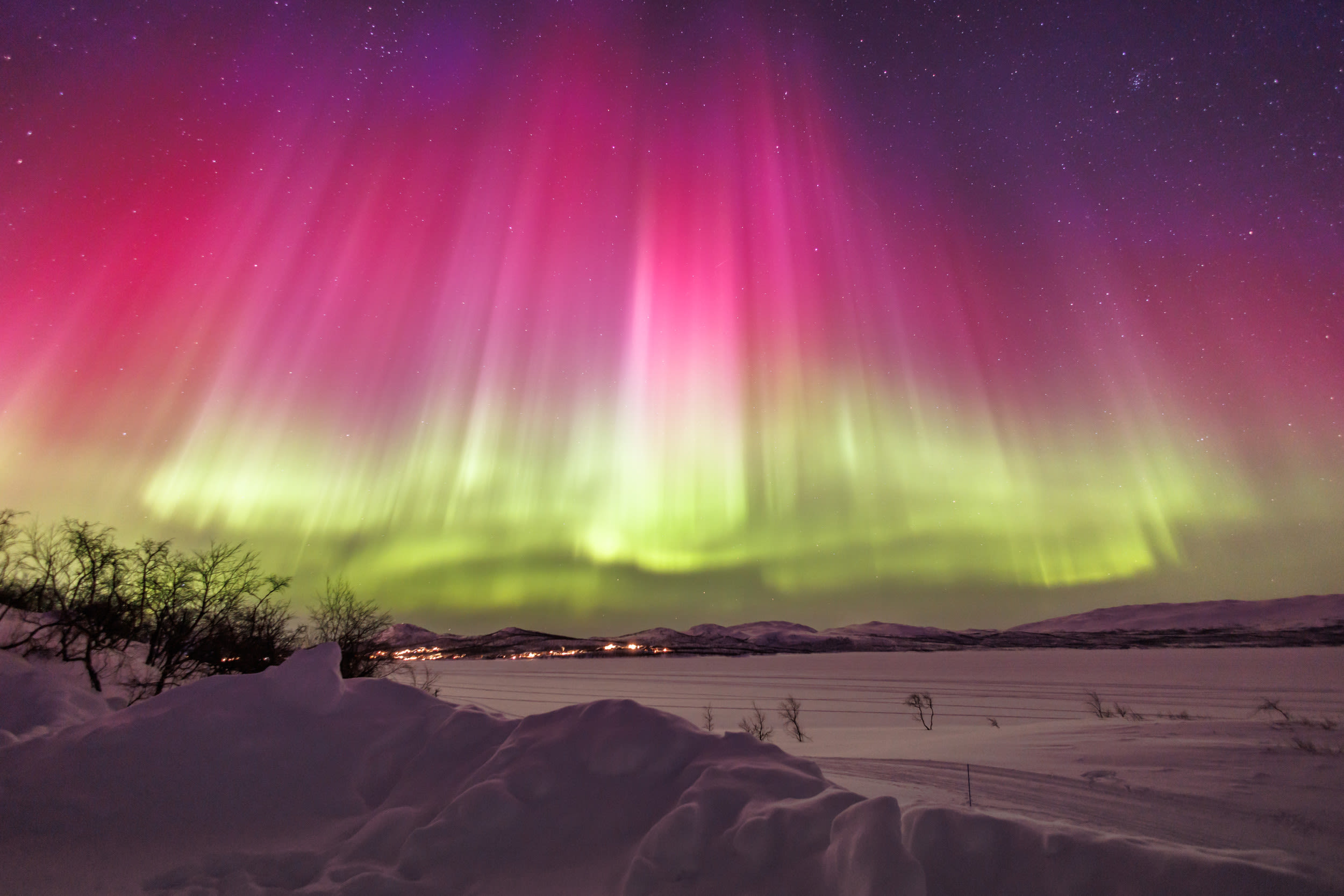 Man drives over 600 miles to capture "magical" rare red northern lights