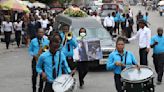 Hundreds mourn gang killings of a Haitian mission director and a young American couple