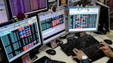 Sensex, Nifty settle marginally down in volatile trade on eventful Budget day