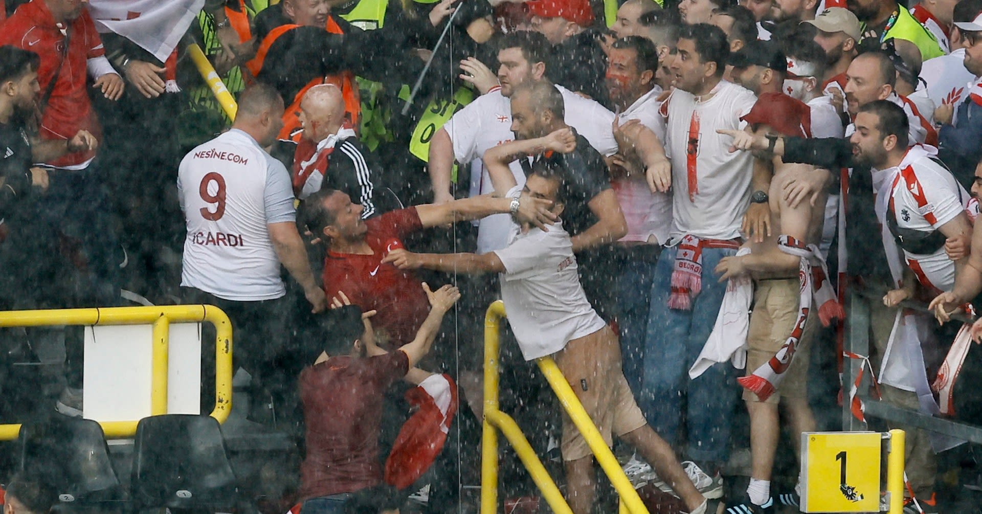 Fans fight in stadium before Turkey v Georgia Euro 2024 match