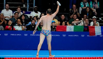 Olympic moment of the day: Cap-catching lifeguard steals the swimming show