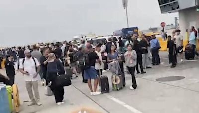 JFK Airport fire chaos sees passengers evacuated as black smoke fills terminal