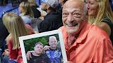 West Virginia grandfather travels hundreds of miles with a picture of his late sons to watch granddaughter graduate