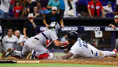 Marlins break up no-hitter in seventh, rally to force extras, still get swept by Red Sox