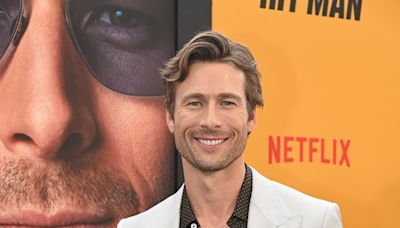 Claims Liam Hemsworth is 'envious' of Glen Powell's success