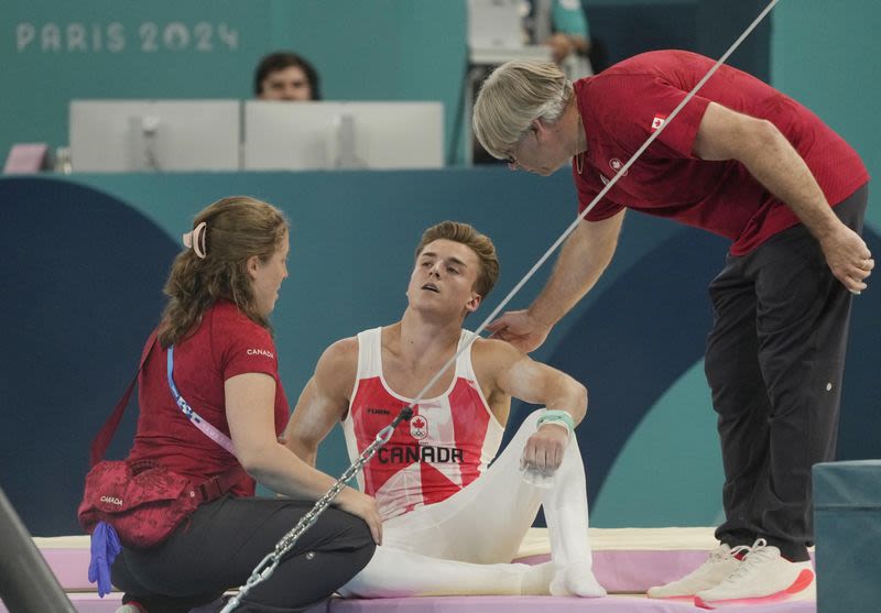 Olympics-Gymnastics-Canada's Dolci gets second chance on bar after equipment malfunction