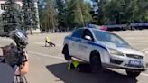 Shock moment police stunt goes horribly wrong as cop is crushed under car