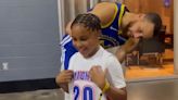 Warriors star Stephen Curry puts a smile on a young fan's face during an impromptu meeting