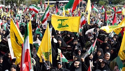 Iran treads carefully, backing Hezbollah while avoiding war