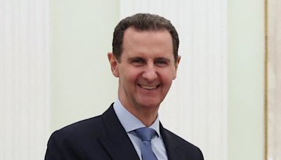 Dictators reunited: Grinning Syrian monster Bashar Assad meets Putin