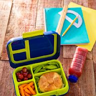 A Japanese-style lunch box with multiple compartments for different foods Often made of plastic or wood Can be decorated with cute designs or characters