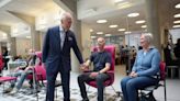 King meets cancer patients as he returns to official duties