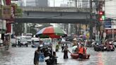 Monsoon rains worsened by offshore typhoon leave 8 dead and displace 600,000 in Philippines