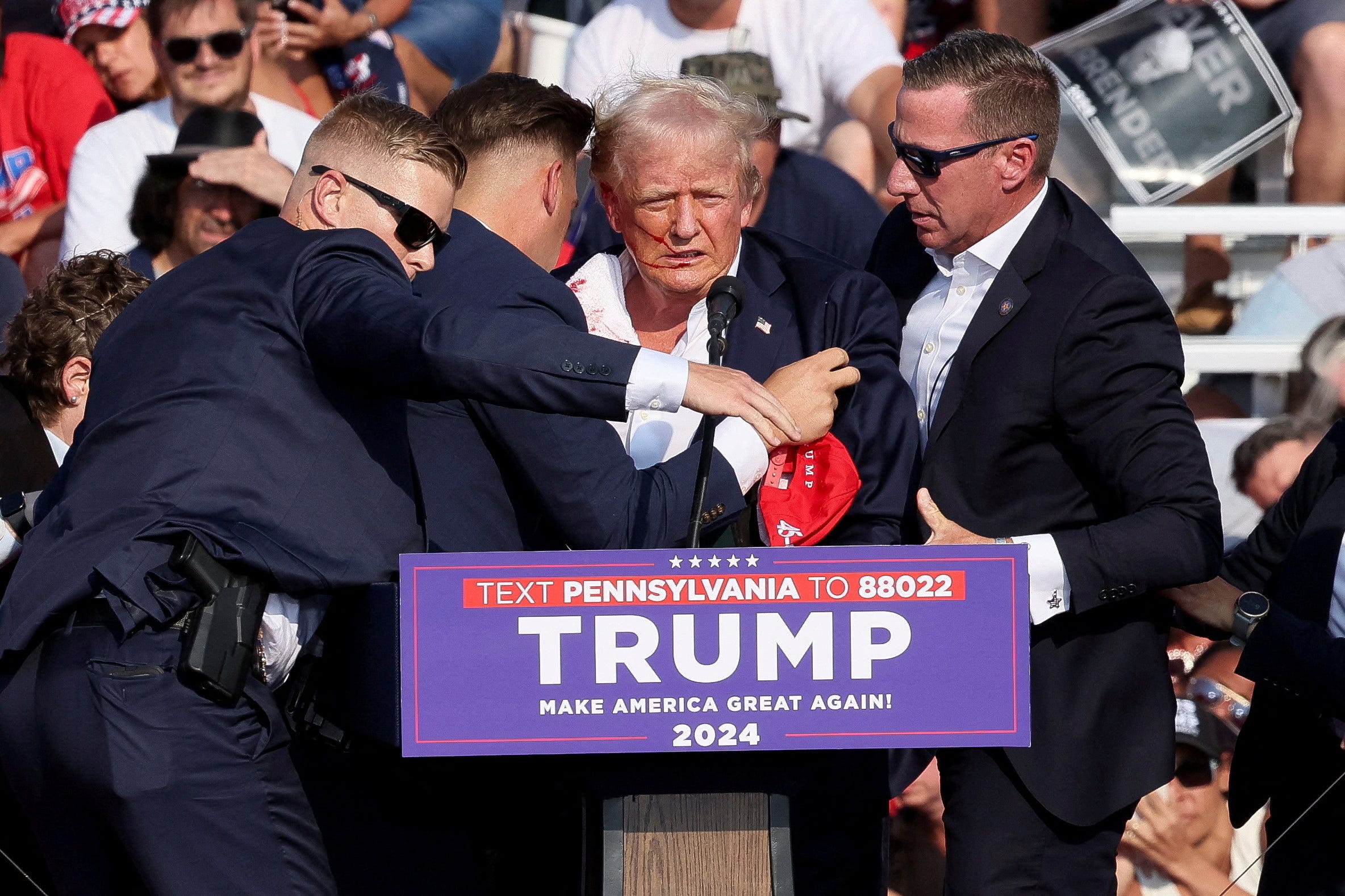 Former Secret Service officials says agents should've kept Trump low, not fist pumping