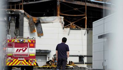 South Korean rescuers search burned factory after a blaze killed 22, mostly Chinese migrants