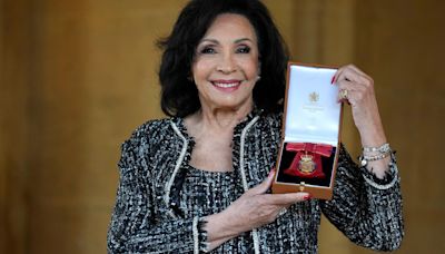 Shirley Bassey receives top honour from the King