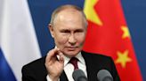Putin in trade push on final day of China trip
